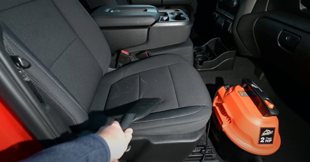 Best Car Vacuum - The Armor All AA255 fit comfortably in front of a car seat